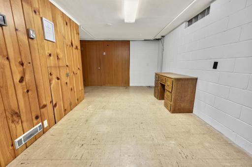 Family Room area opens to an area perfect for art, a bar or pool table.