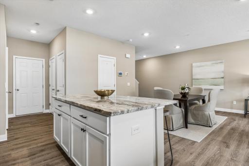 Center island and the Dining Area. The open-flow floorpan is perfect for casual living and guest entertaining.
