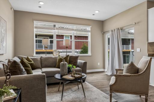 The comfortable living room with patio doors leading outside.