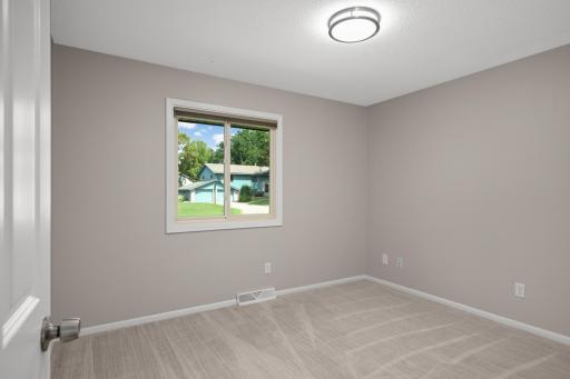 Spacious second bedroom on the main level.