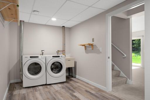 Down the stairs, go right to the laundry/storage room. Spacious to store things out of sight.