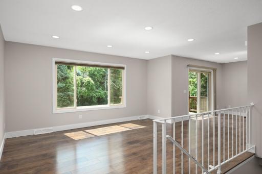 The living room is very spacious with huge windows allowing for tons of natural light.