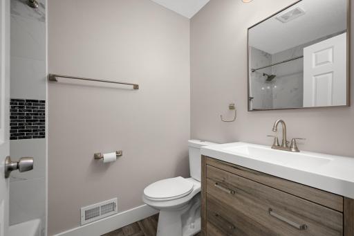 Full bath on the main level with updated fixtures.