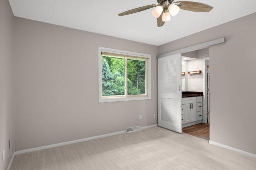 Another view of the owner's suite with a huge window out to the back yard and door to the private bath.