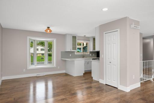 Large dining space with a bay window and another closet/pantry.