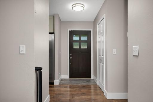 Walk into the front door to an inviting foyer, well lit and a convenient coat closet.