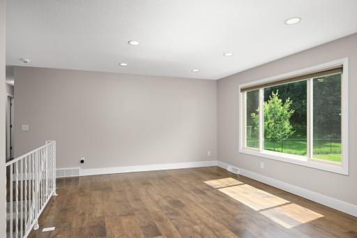 Low maintenance flooring, tall ceilings, recessed lighting and neutral paint.