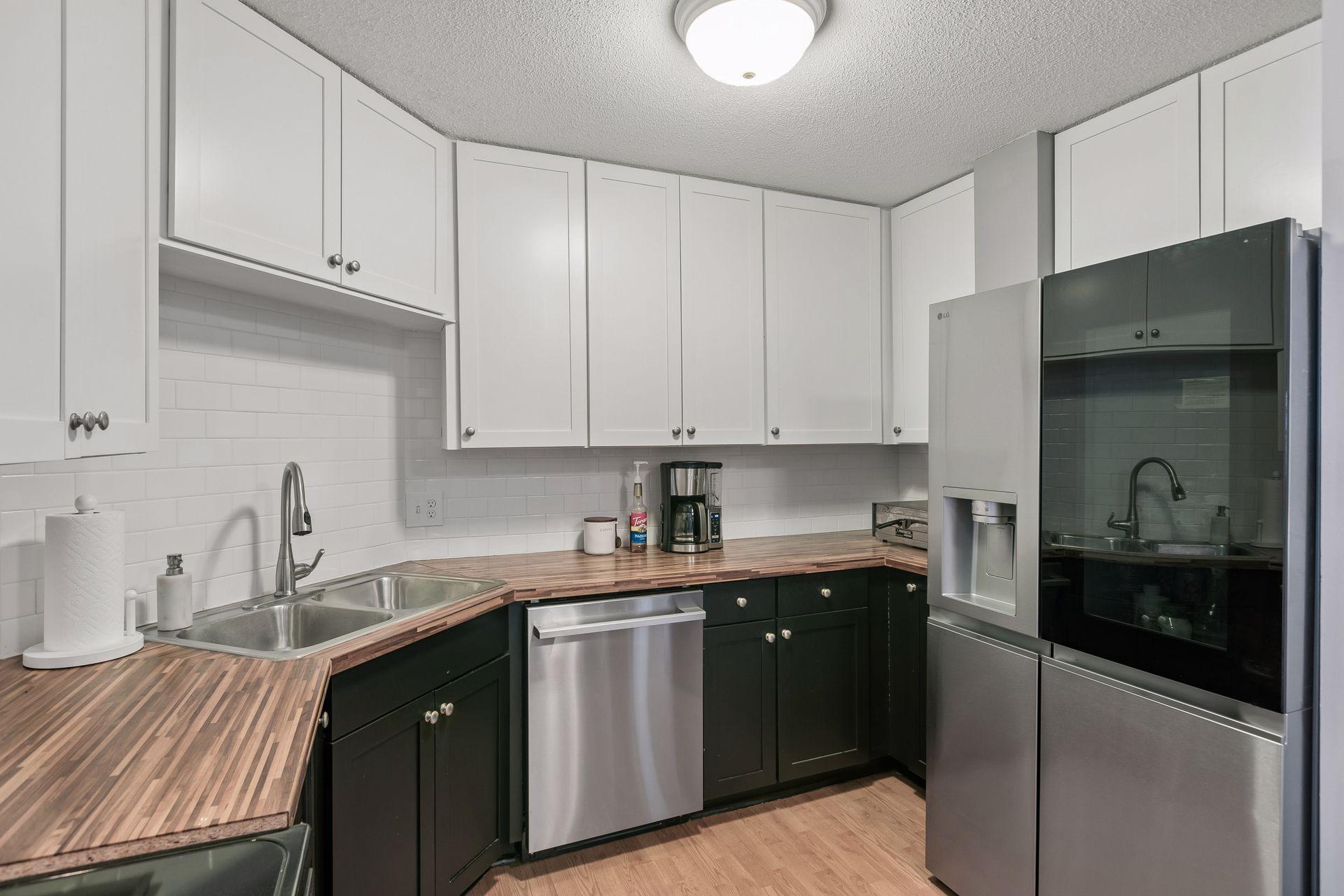 Updated kitchen with new LG Studio Refrigrator and dishwasher July 2026.