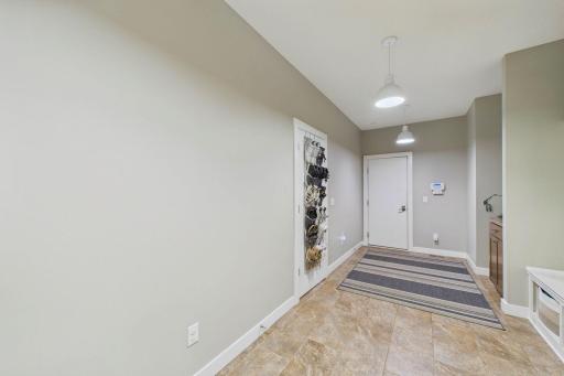 Another view of the mudroom from the other direction. Ahead is access to the garage which is a 2+ garage with tremendous storage with a built-in Monkey Bar system to keep garage organized and items of the ground.