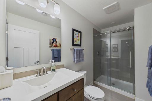 The lower-level bathroom! Functional and clean for guests and the 5th bedroom.
