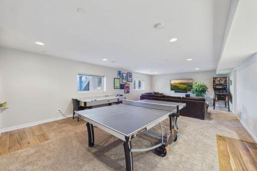 The family room is incredibly versatile with so much space! Also, the natural light through the windows and the recessed lighting add a great deal to this level.