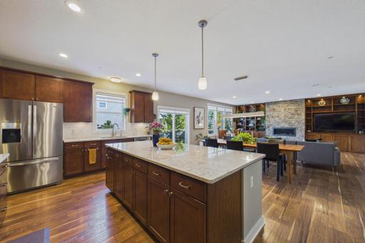 Another view of the open-concept main floor and additional cabinets under the kitchen island. The lighting has also been replaced throughout the home.