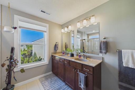 The primary bathroom view of the double vanity sinks and plenty of countertop space!
