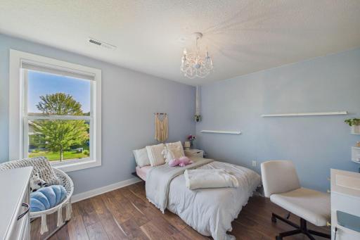 One of four bedrooms on this level. This bedroom features a walk-in closet and updated flooring.