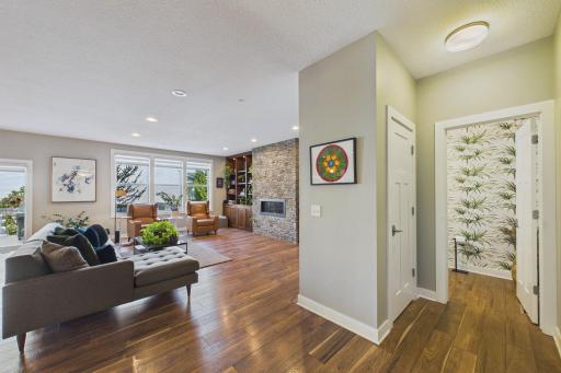 As you step into the home past the office is the updated 1/2 bath to the right. Note the ample lighting through the large windows on the main-floor.