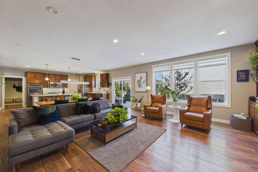 The open-concept main floor brings great functionality to daily living. The modern updated luxury vinyl plank flooring blends elegance and comfort.