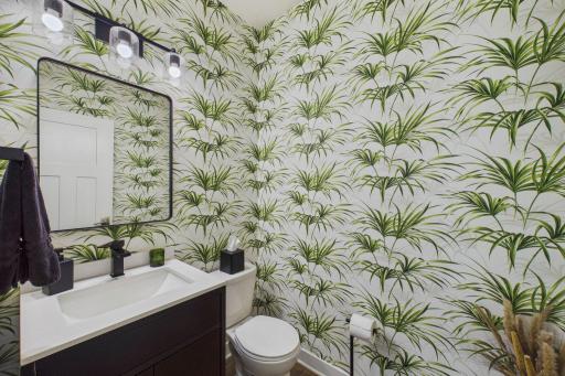 The updated main-floor half bath located in a central area further elevates the home's appeal.