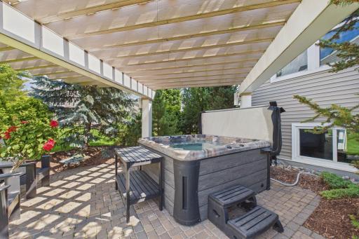 The paver patio and pergola with accent lights is the perfect place to relax in the evenings.