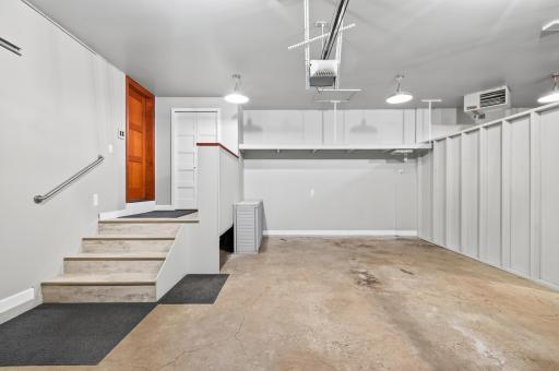 Attached fully finished, insulated and heated garage with overhead storage, bright lighting and convenient interior access.