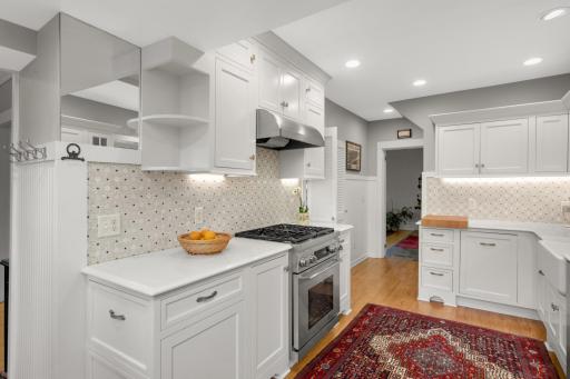 pretty tile backsplash and stainless steel appliances