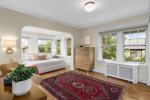 Primary bedroom/sunroom has lots of light