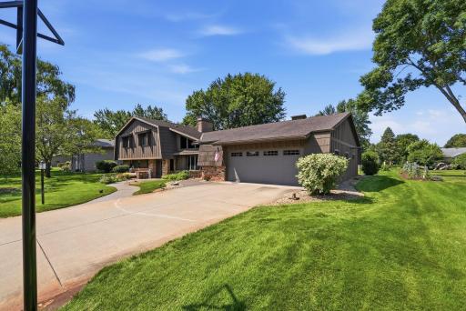 Driveway accommodates multiple vehicles.