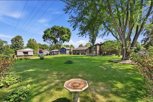 The expansive yard offers flexibility for recreation, pets, or future outdoor projects.