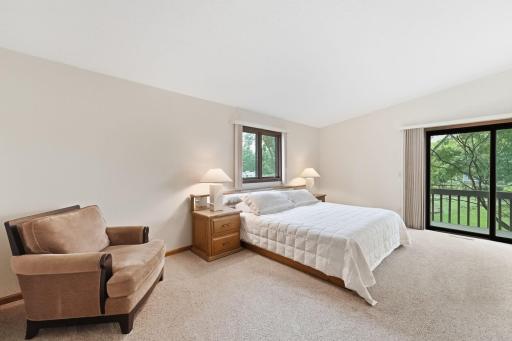 A spacious primary suite provides ample space for a king-size bed and additional furnishings.