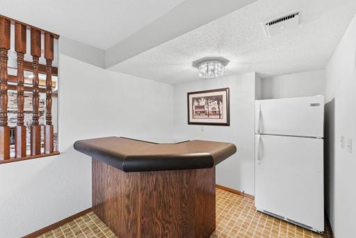 Perfectly suited for hosting, the wet bar gives guests a natural place to gather.