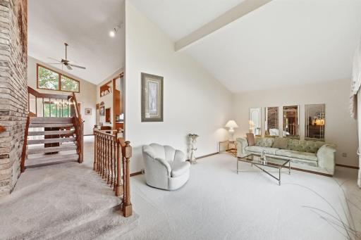 A polished living area provides flexibility for hosting guests or creating a sophisticated sitting room.