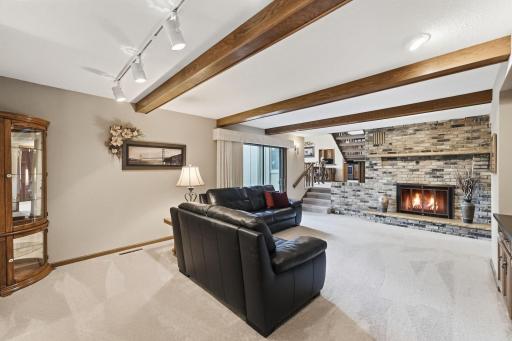 Floor to ceiling bricked in fireplace becomes a focal point of this room.