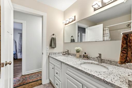 Full bath walks thru to hallways