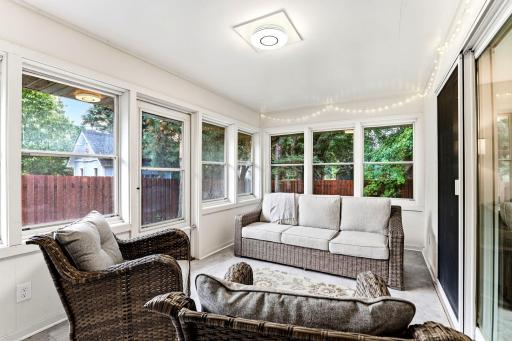 Three season porch walks out to fenced yard