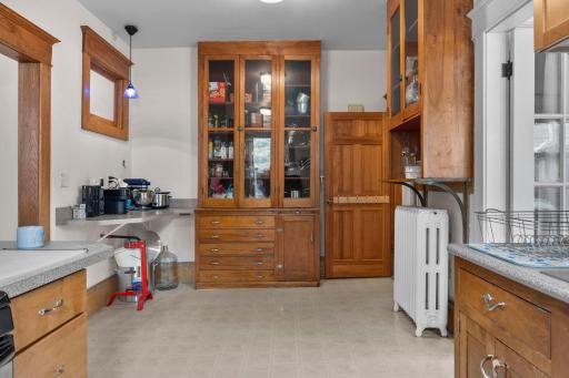 Each kitchen has original built in cabinets