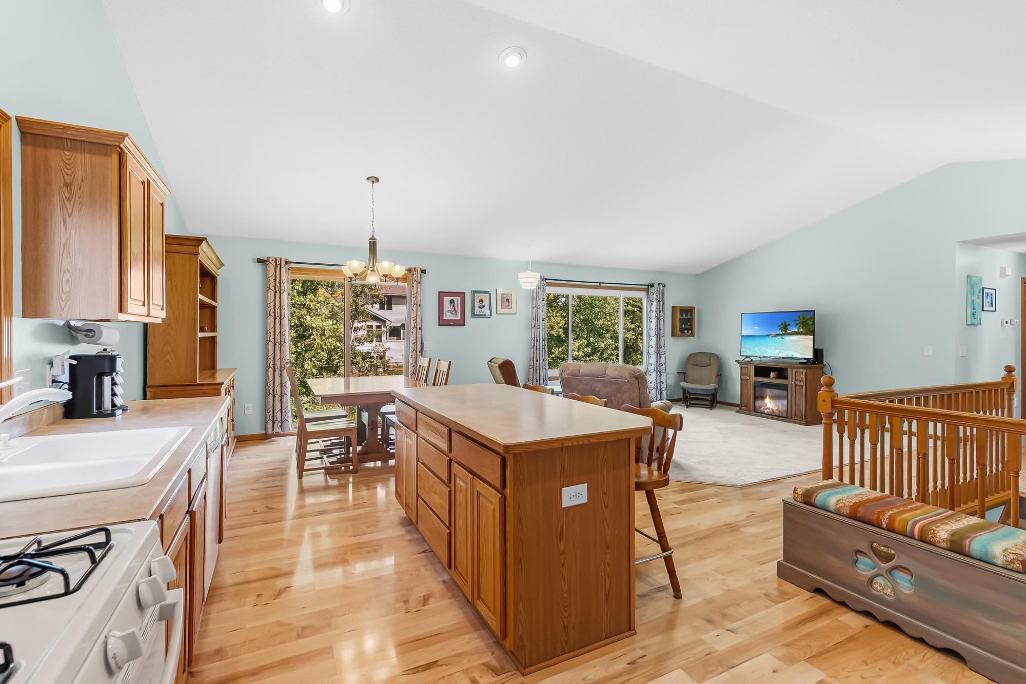 A fantastic layout that keeps everyone connected between the kitchen, dining, and living areas.