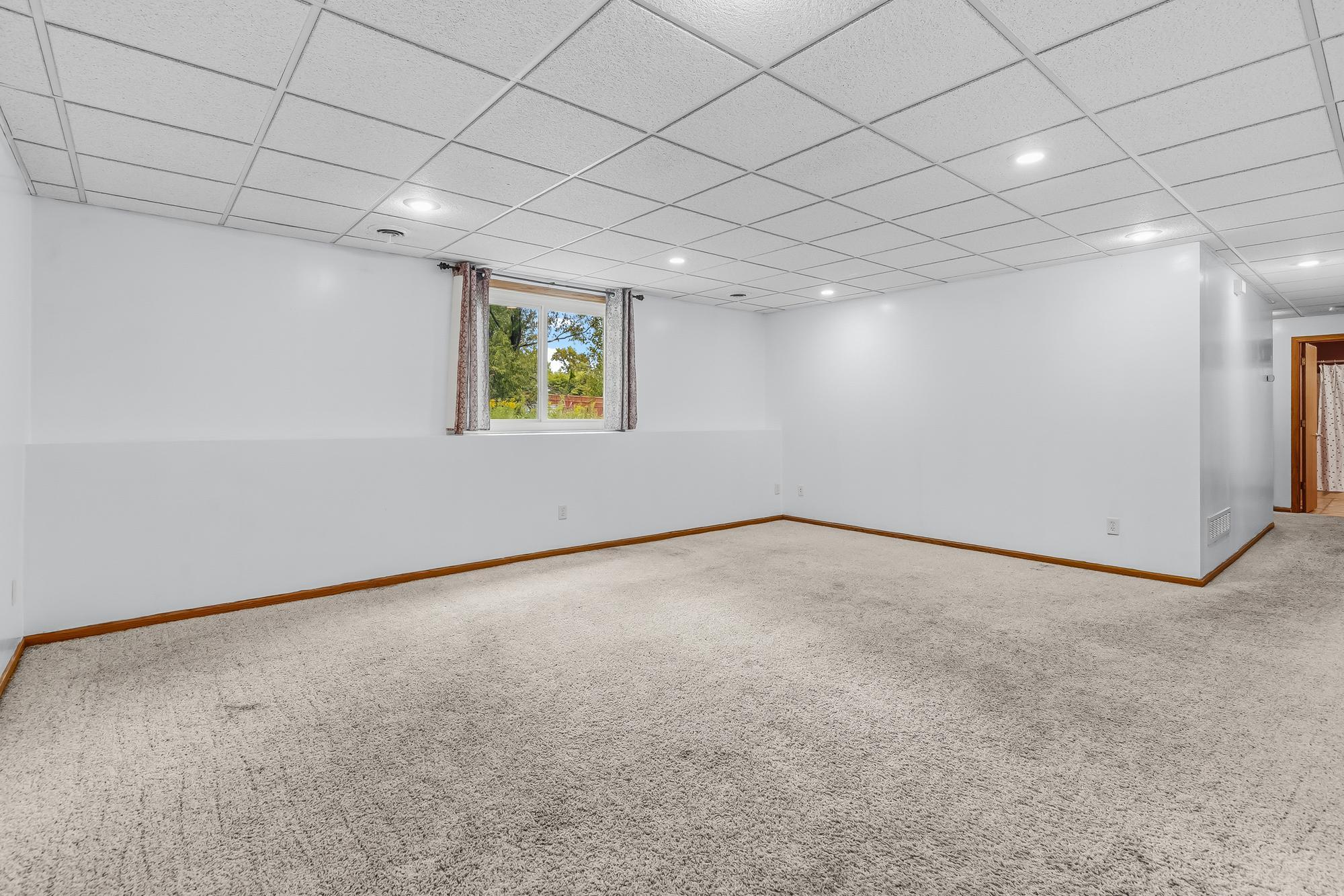The finished lower-level family room provides massive extra living space and features bright daylight windows.