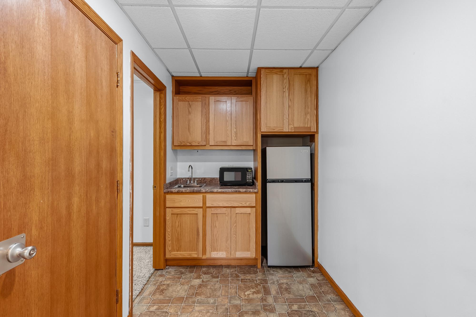 A closer look at the convenient lower-level wet bar, ready for your next game night or gathering.