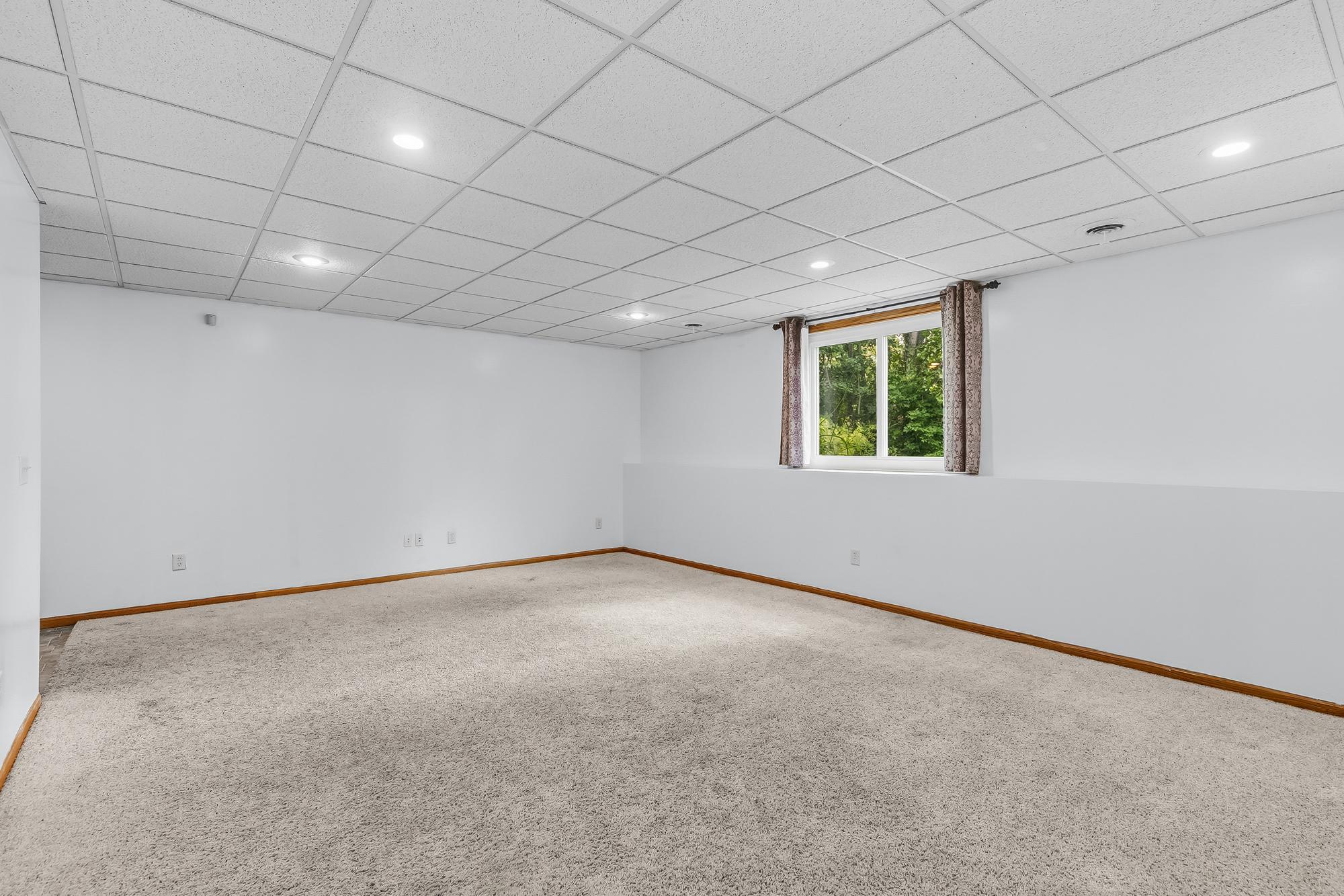 The sprawling 19x16 family room offers excellent flexible living space and bright daylight windows.