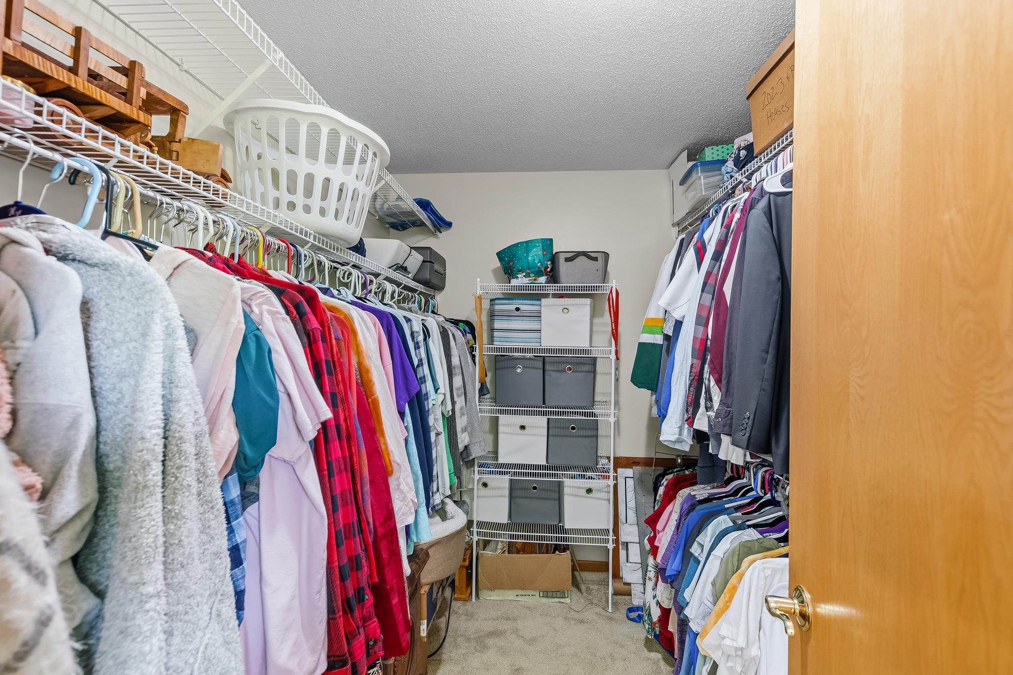 Never run out of wardrobe space in the primary suite's generously sized walk-in closet.