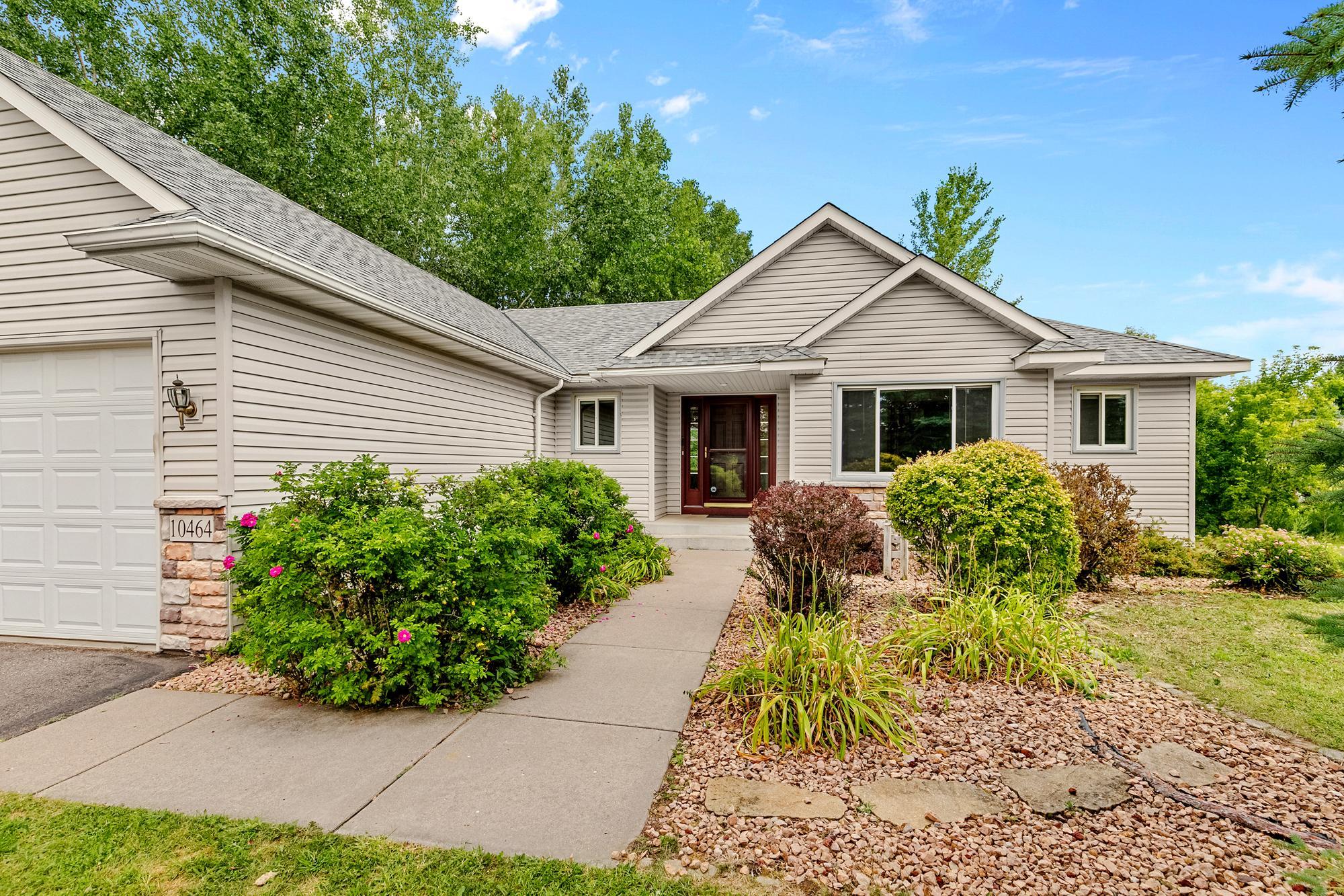 Follow the path to your new home! The welcoming front entrance is perfectly framed by beautiful low-maintenance landscaping and rock gardens.