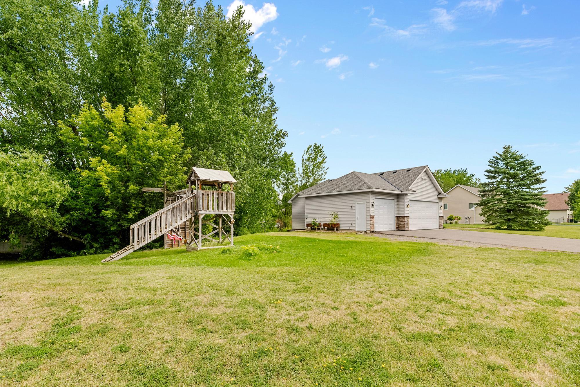 The side yard offers even more room to play and explore, located right off the attached 3-car garage.