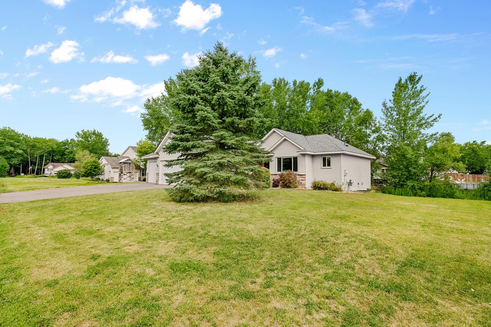 Set on a half-acre lot, this home features beautiful mature trees and an expansive front yard.