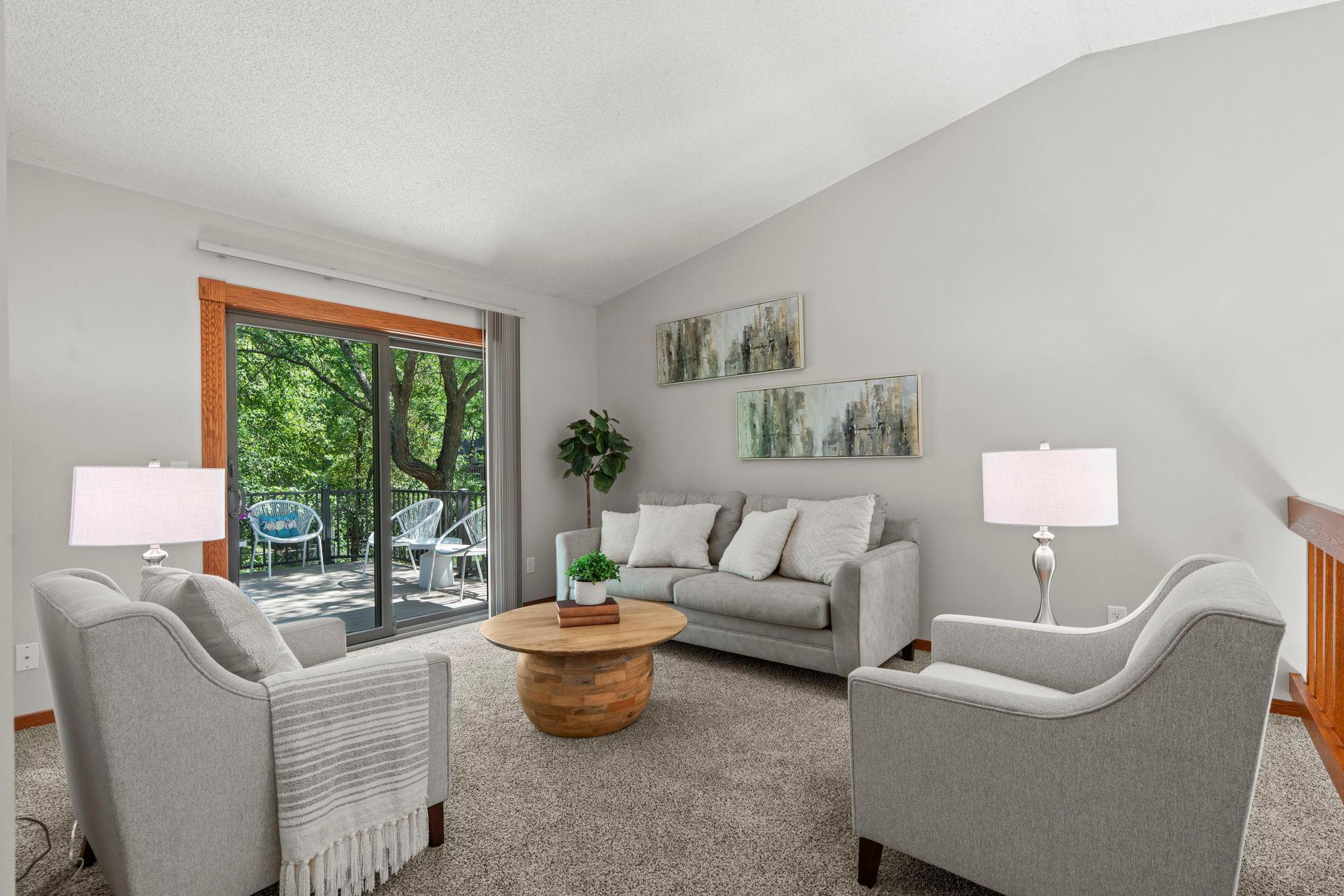 Upper level living room with access to the deck