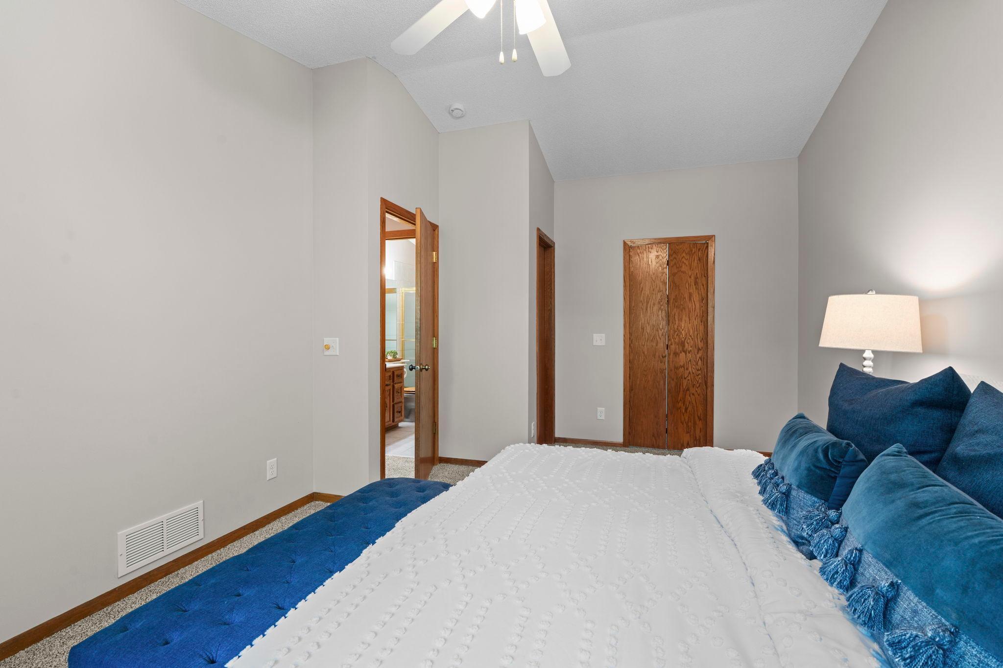 Primary bedroom with large closet and walk-through to bathroom