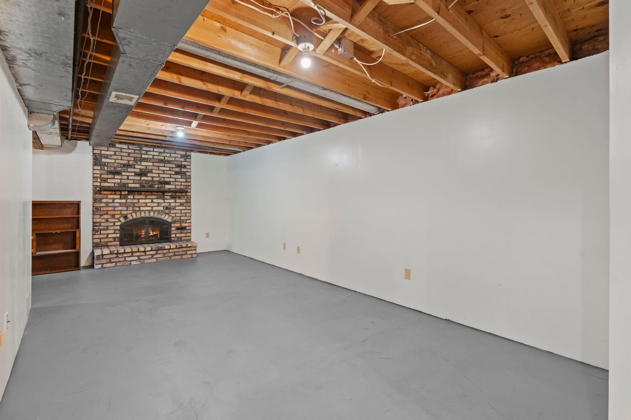 Beautiful brick surround firplace perfect for a future family room.