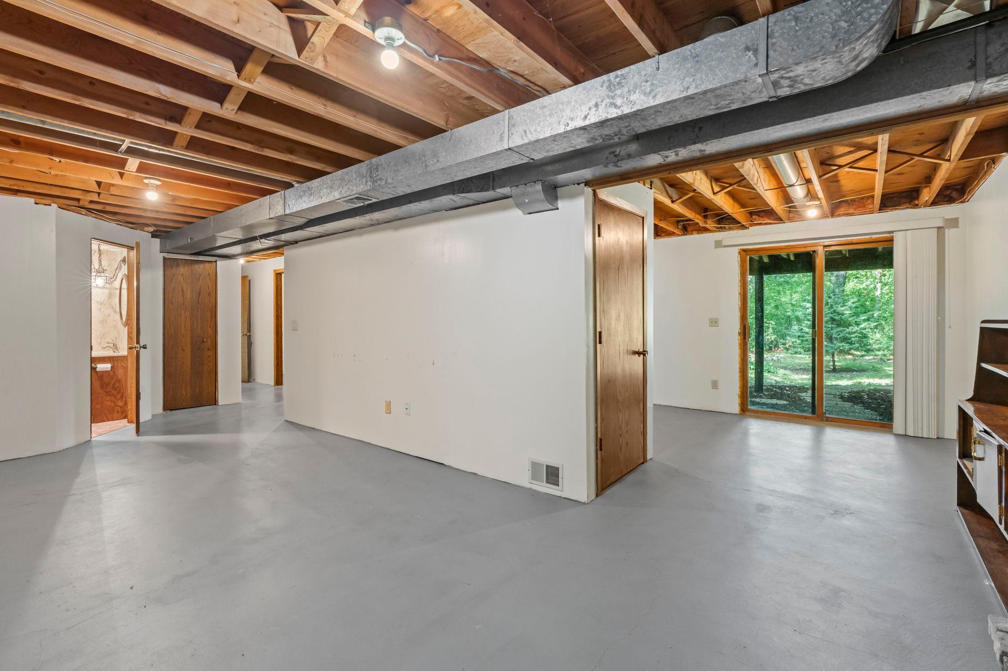 Partially finished lower level with walk-out access to the backyard.