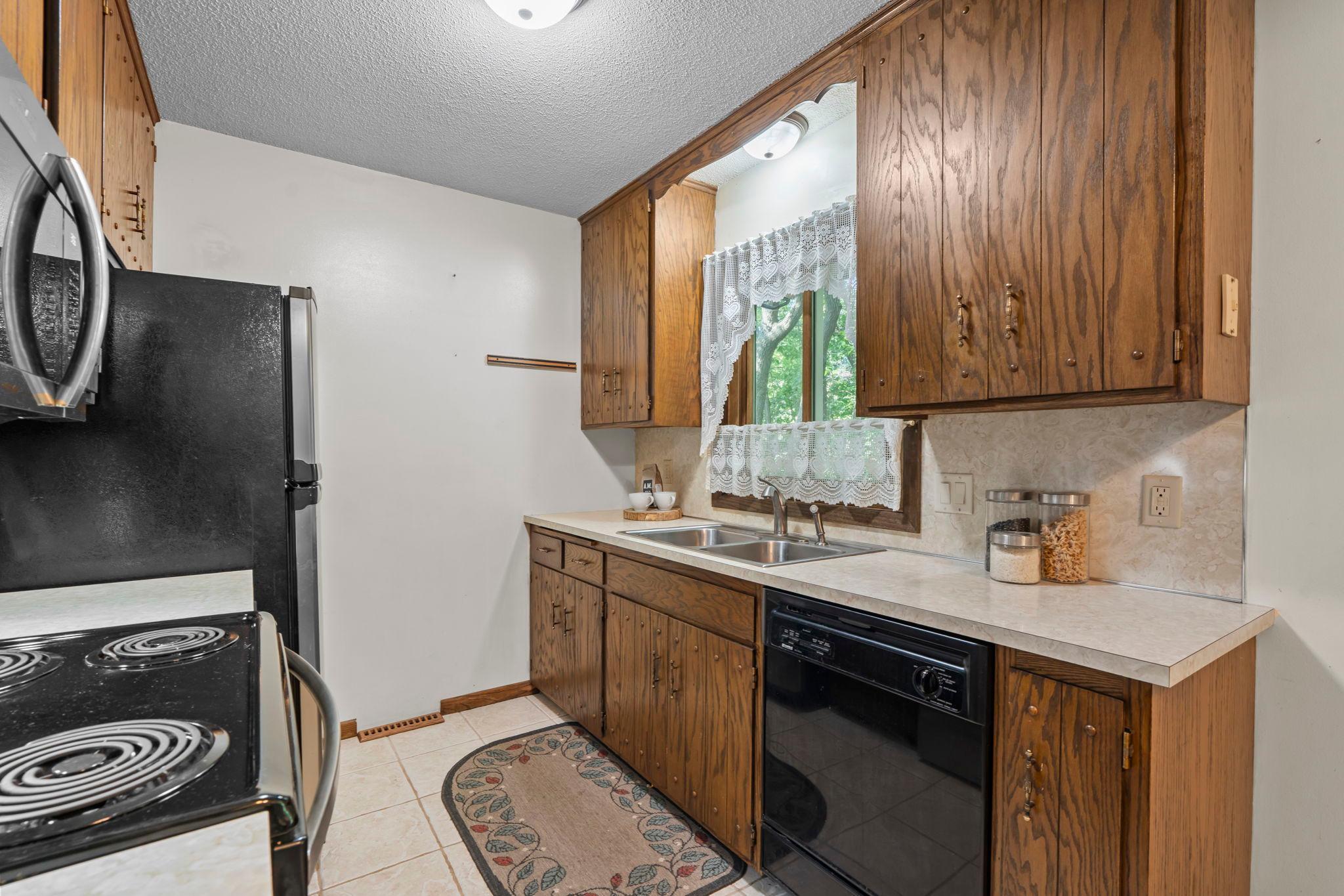 Large window overlooking the backyard and deck perfect for everyday living and entertaining.