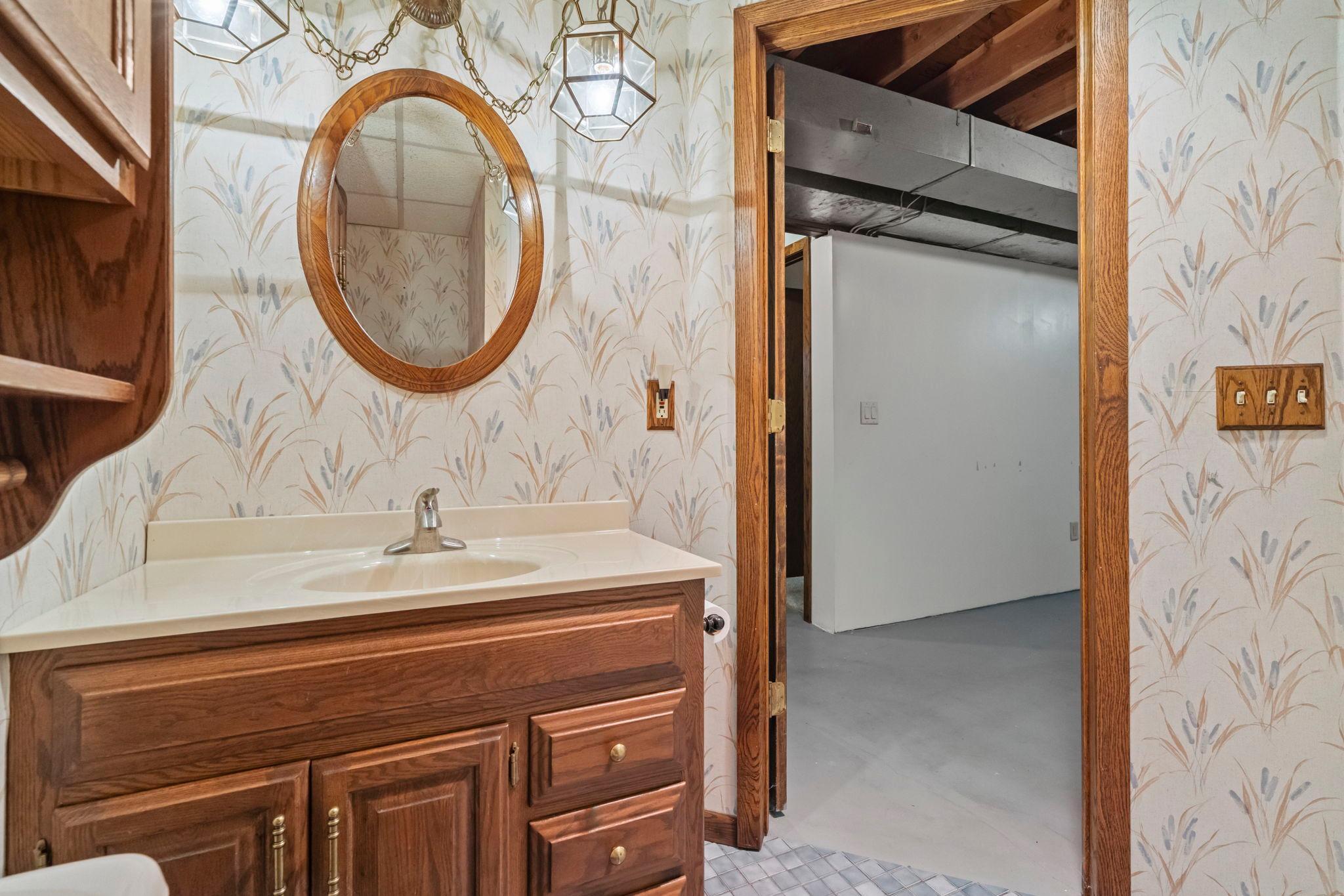 A 3/4 bathroom serving the lower level.