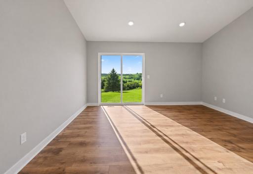 The kitchen area opens up to the main living area. Photo is of similar home. Colors and options may vary. Ask Sales Agent for details.