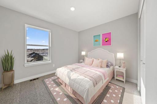 In addition to the primary bedroom, the home's upper level also includes these two additional bedrooms, and another full bathroom just adjacent to each! Photo is of similar staged home. Colors and options may vary. Ask Sales Agent for details.
